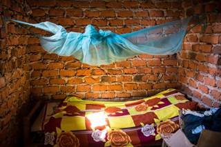 Malaria infection prevalence after 9 months was lower in the 2 groups that received PBO long-lasting insecticidal nets. <i>Photo Credit: BK Kapella, MD (CDR; USPHS).</i> Malaria infection prevalence after 9 months was lower in the 2 groups that received PBO long-lasting insecticidal nets. <i>Photo Credit: BK Kapella, MD (CDR; USPHS).</i>